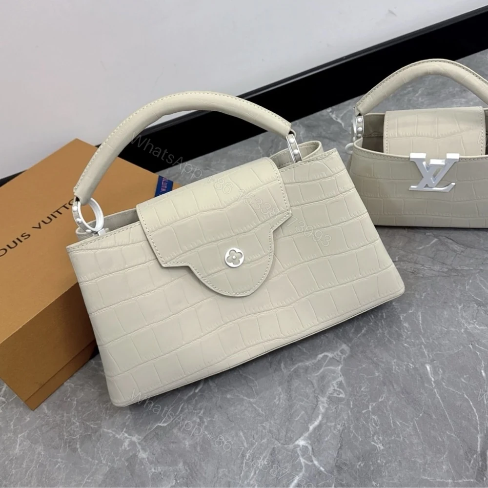 View 2 of Louis Vuitton Capucines MM East West In Grey 33Cm