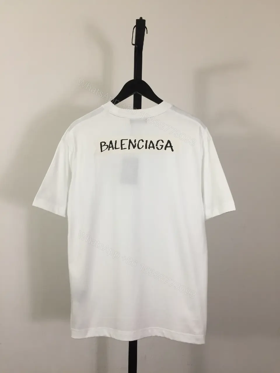 View 6 of Minimalist White Tee with Luxe Subtle Logo – Modern Essential T-Shirt