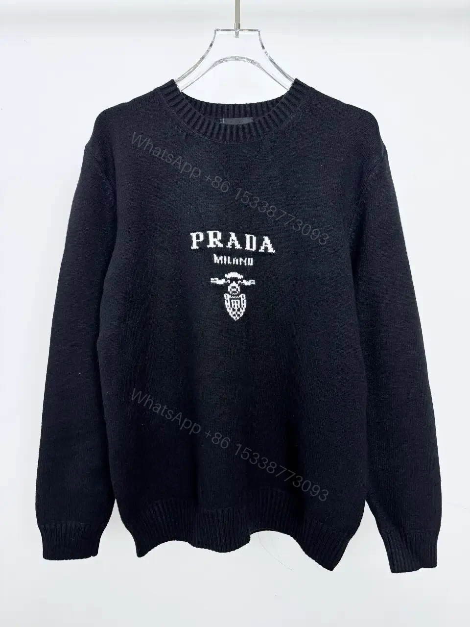 View 8 of Black Knit Pullover with Crest – Elevated Comfort Knitwear