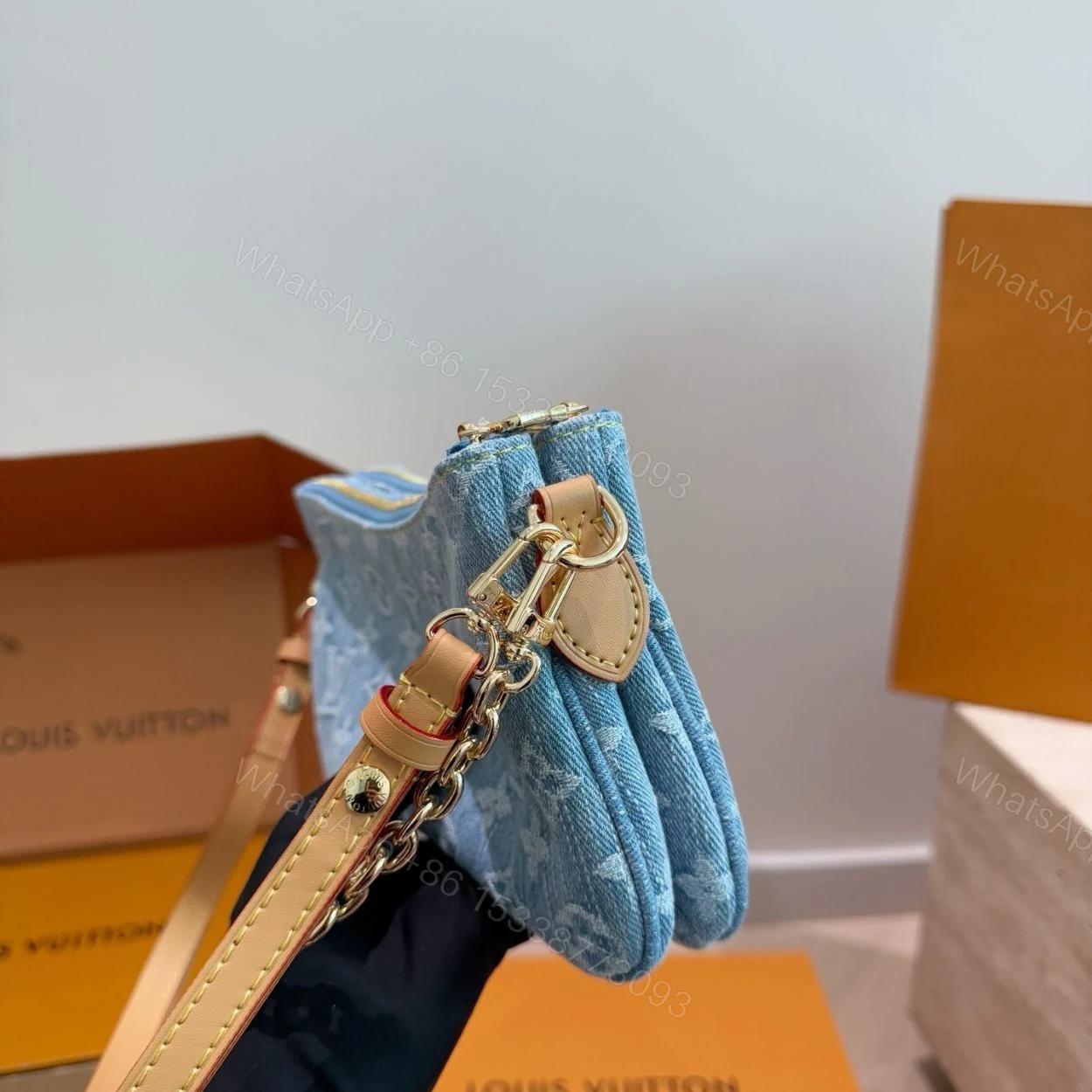 View 7 of Louis Vuitton Liv Pochette Blue Denim 25Cm M83532