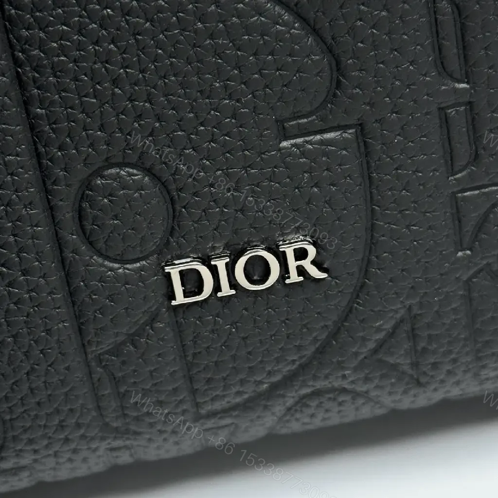 View 10 of Compact Leather Crossbody Bag - Embossed Texture, Luxury Minimalism