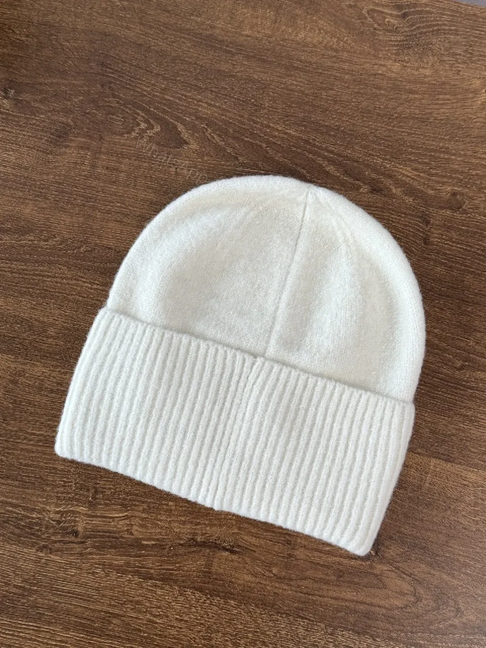 View 7 of Chic Minimalism Beanie: Off-White Knit, Embroidered Logo, Everyday Luxury