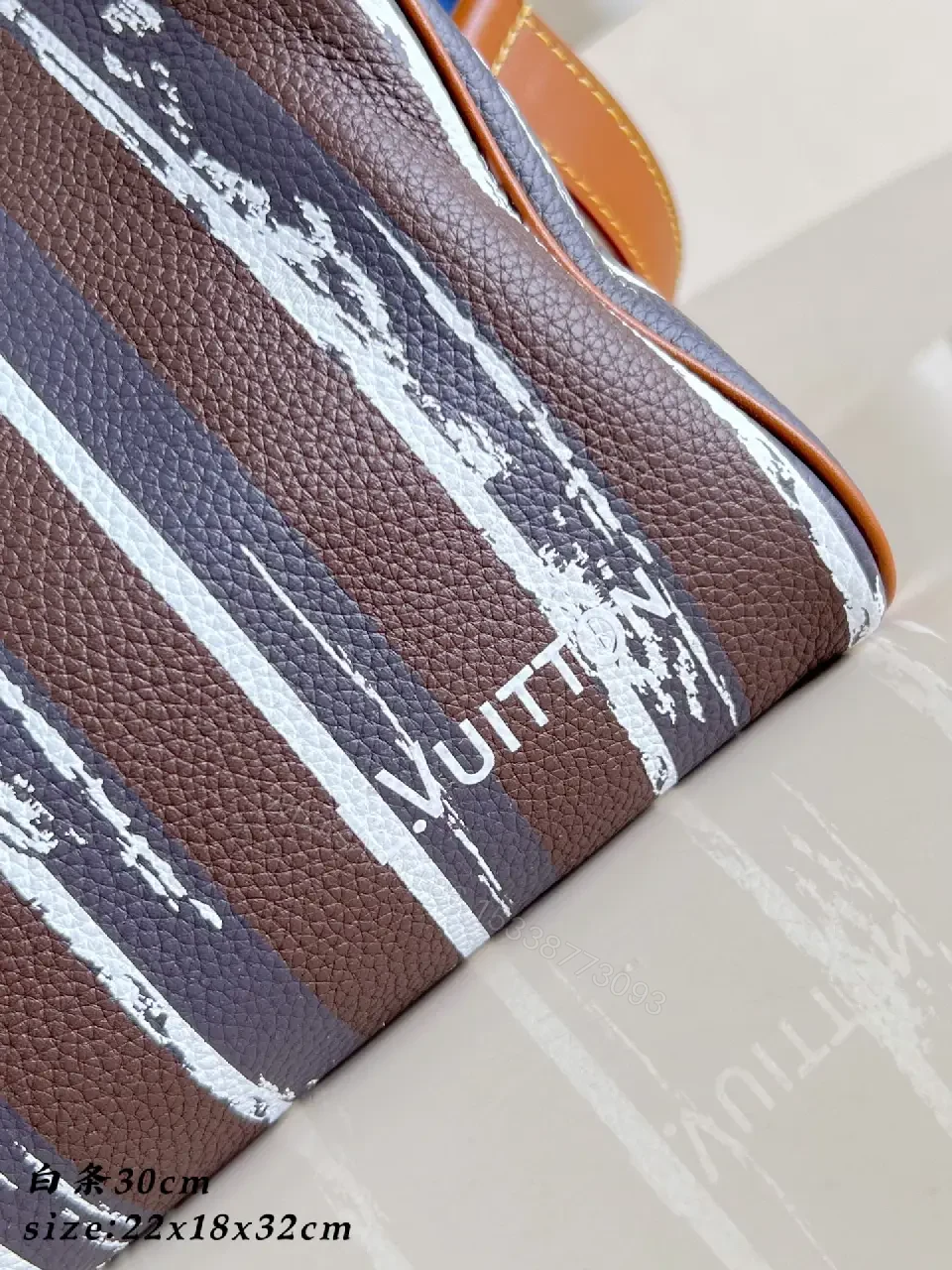 View 7 of Brown leather handbag with striped monogram pattern for luxury everyday use