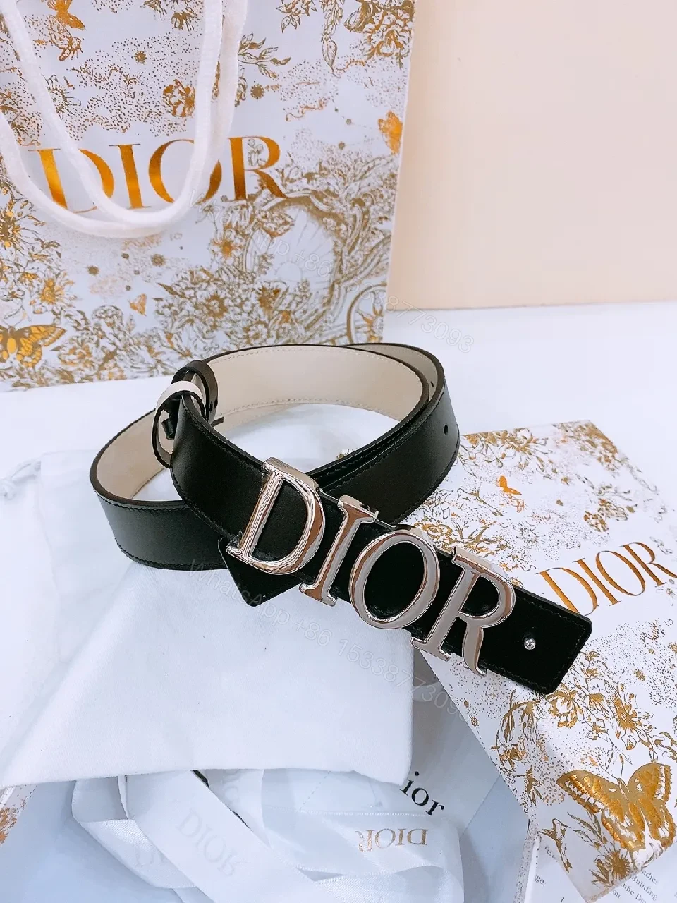 View 2 of Chic Black Leather Belt with Logo Buckle—Statement Accessory