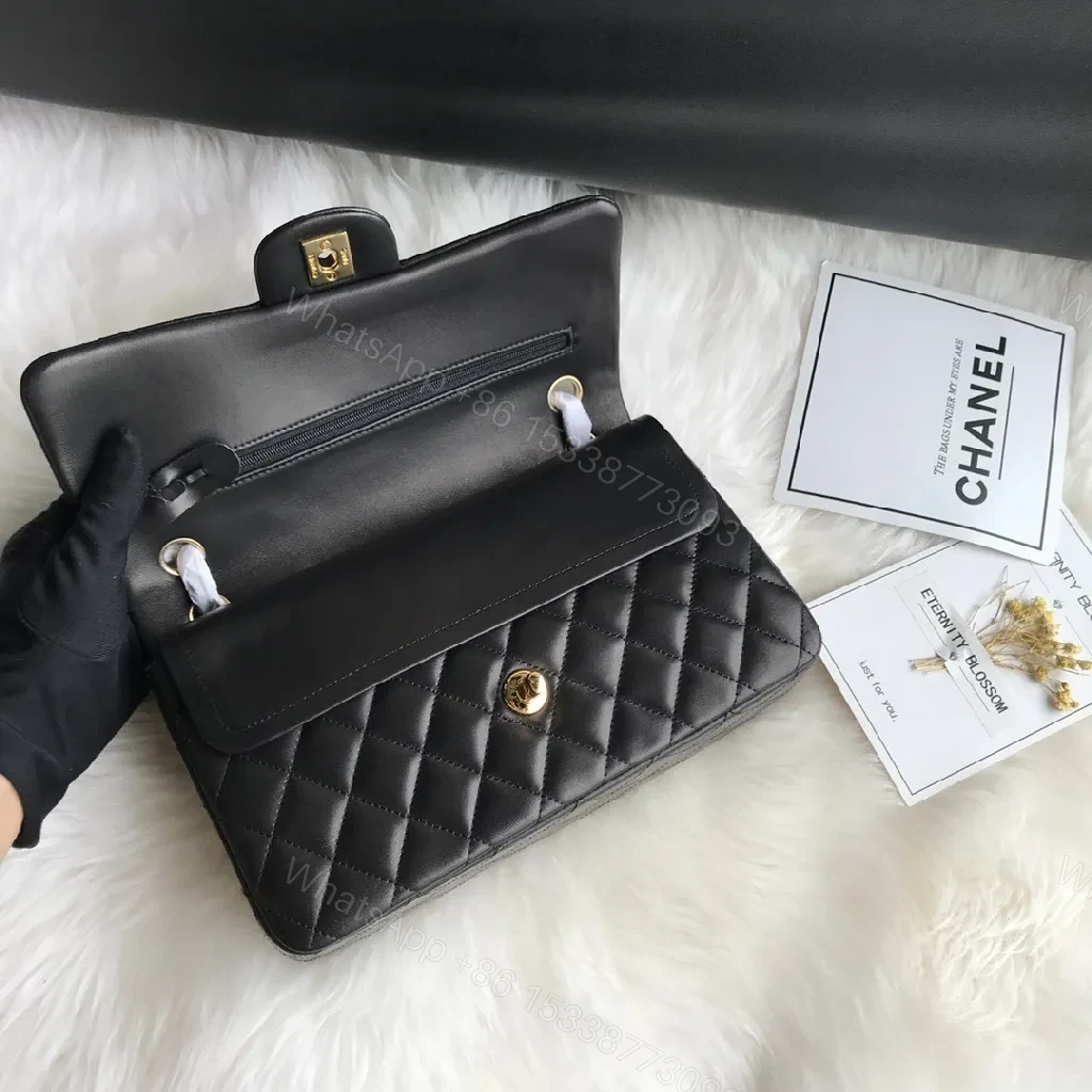 View 2 of Quilted Black Handbag with Gold Clasp – Luxe Chic Style