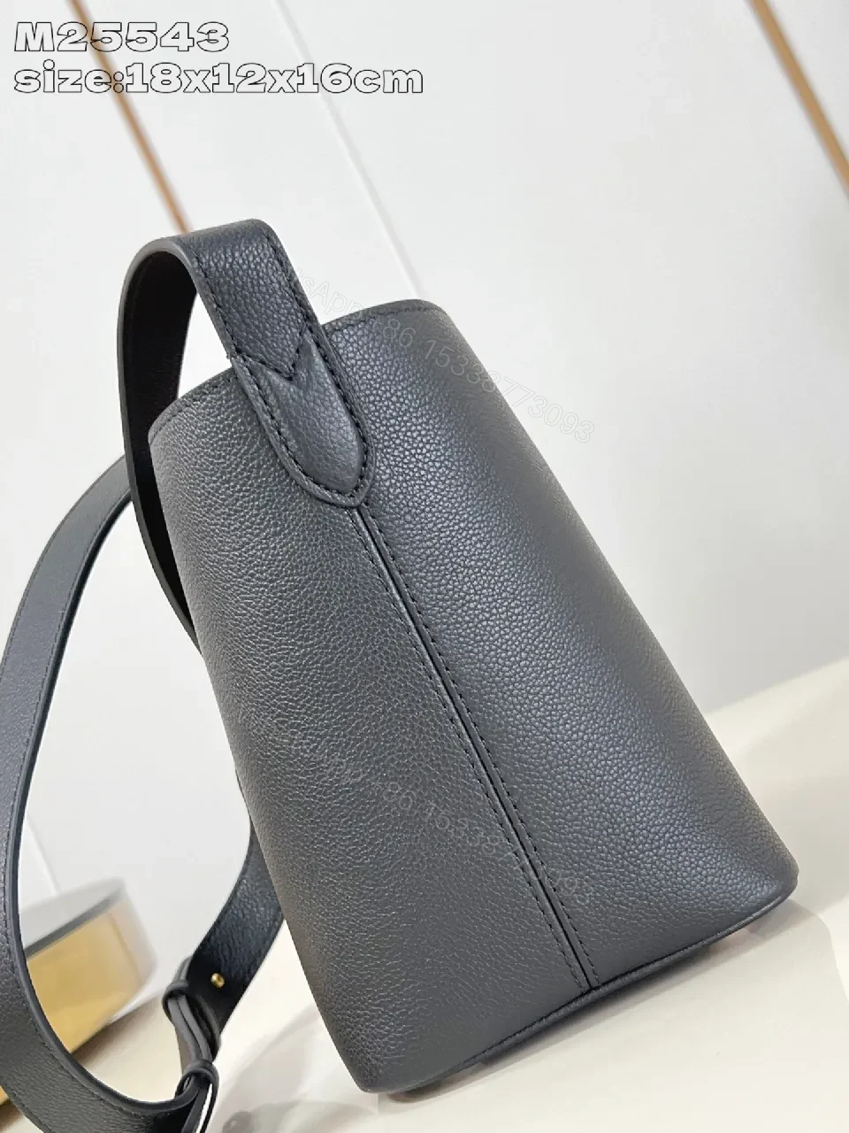 View 5 of Polished Grain Leather Bucket Bag with Gold Hardware, Minimalist Style, Everyday Carry