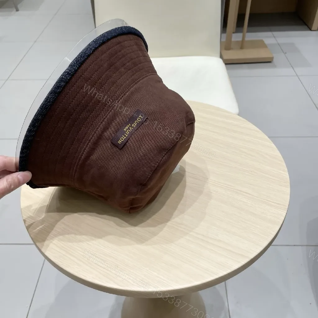 View 2 of Denim Bucket Hat + Embroidered Logo + Streetwear Chic + Luxury Detail + Hat