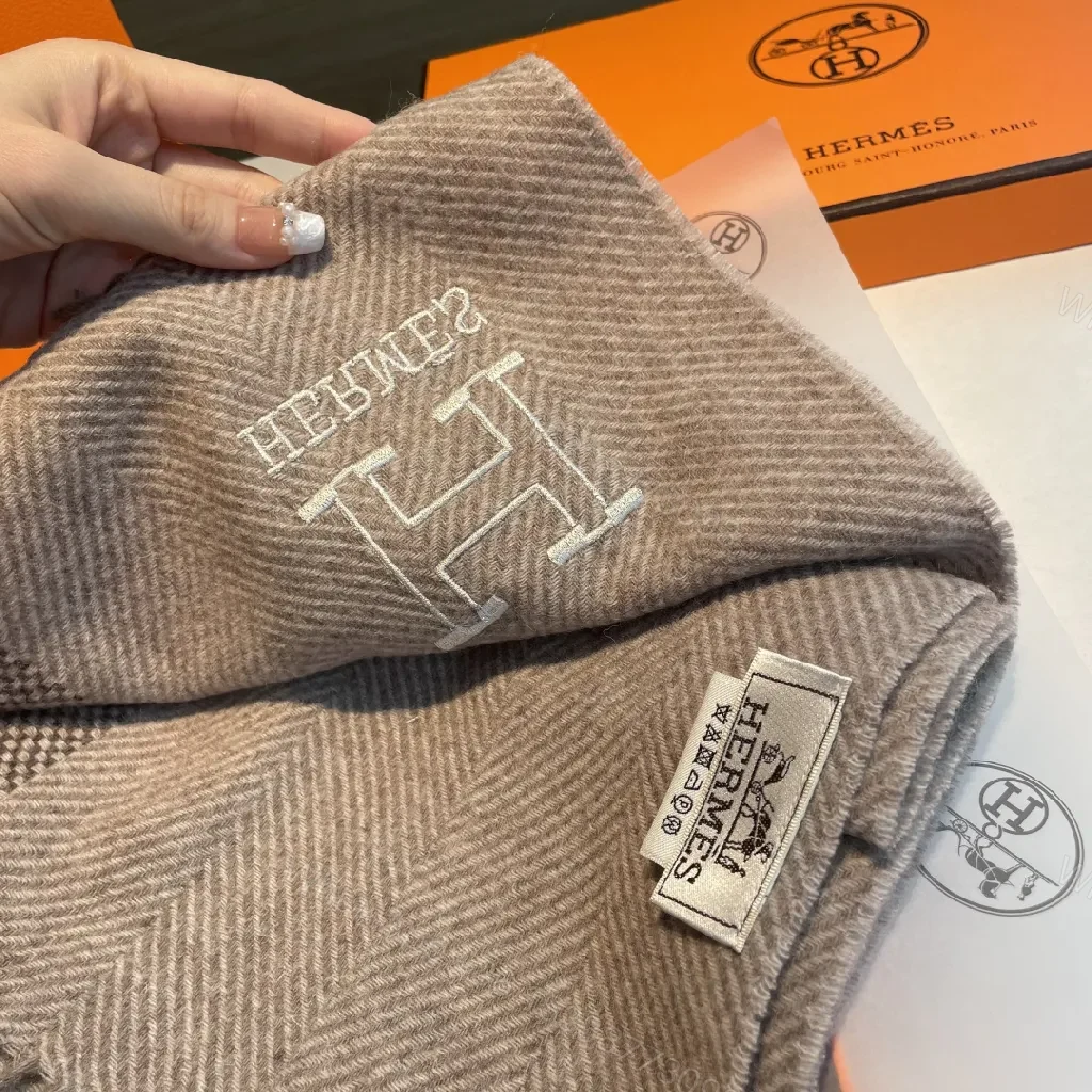 View 5 of Neutral Herringbone Knit Scarf with Subtle Emblem Detail