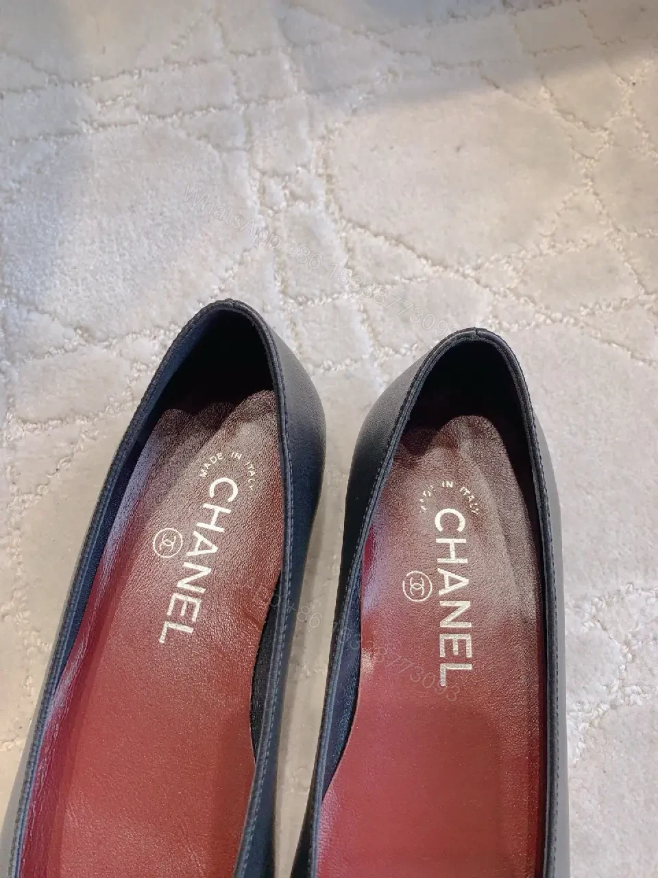 View 3 of Chic Black Pointed Flats with Floral Pom-Pom Detail