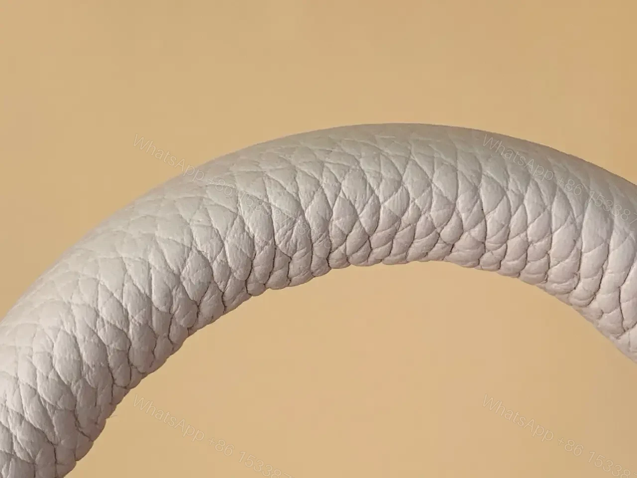 View 4 of Chic Textured Leather Mini Bag with Gold Emblem