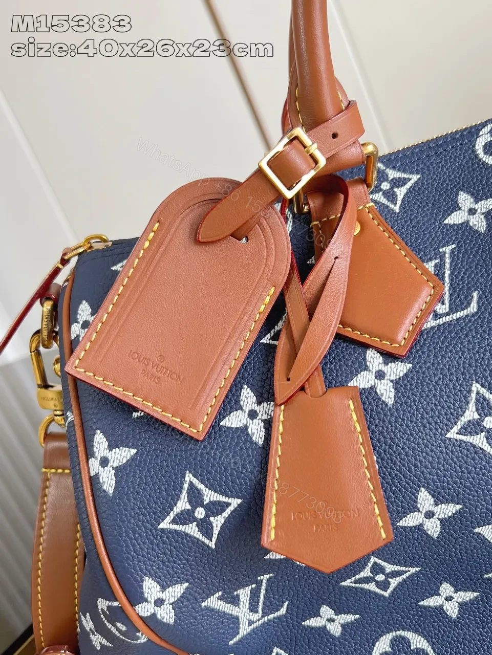 View 2 of Structured Luxe Carryall: Navy Monogram Tote with Cognac Leather