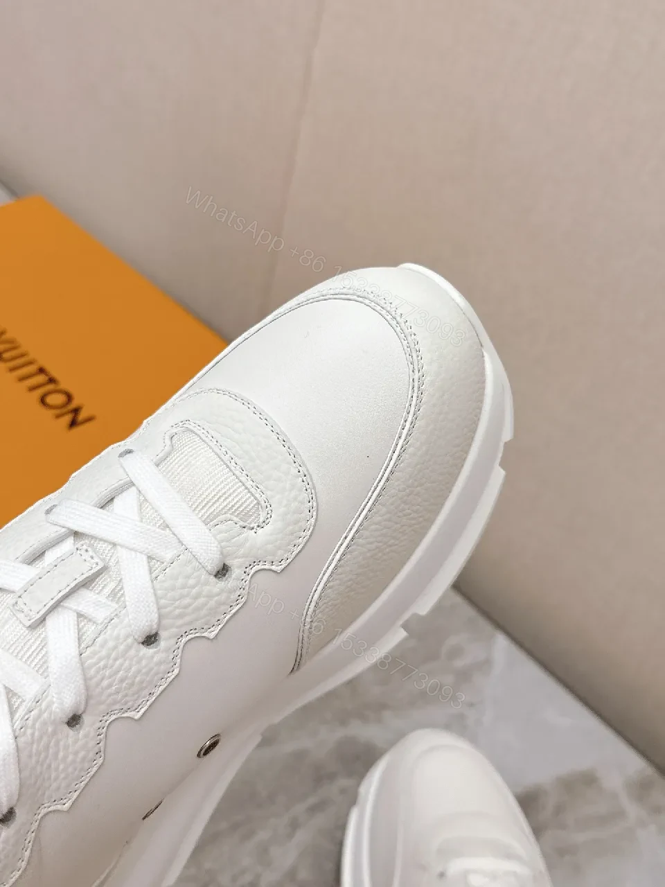 View 4 of White Leather Low-Profile Sneakers with Monogram Detailing