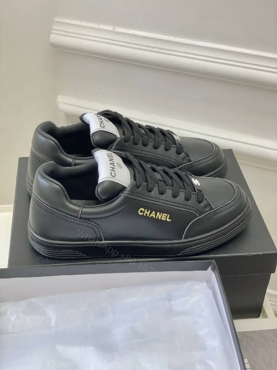 View 4 of Black Leather Sneakers, Subtle Gold Accents, High-Top Style, Everyday Luxury