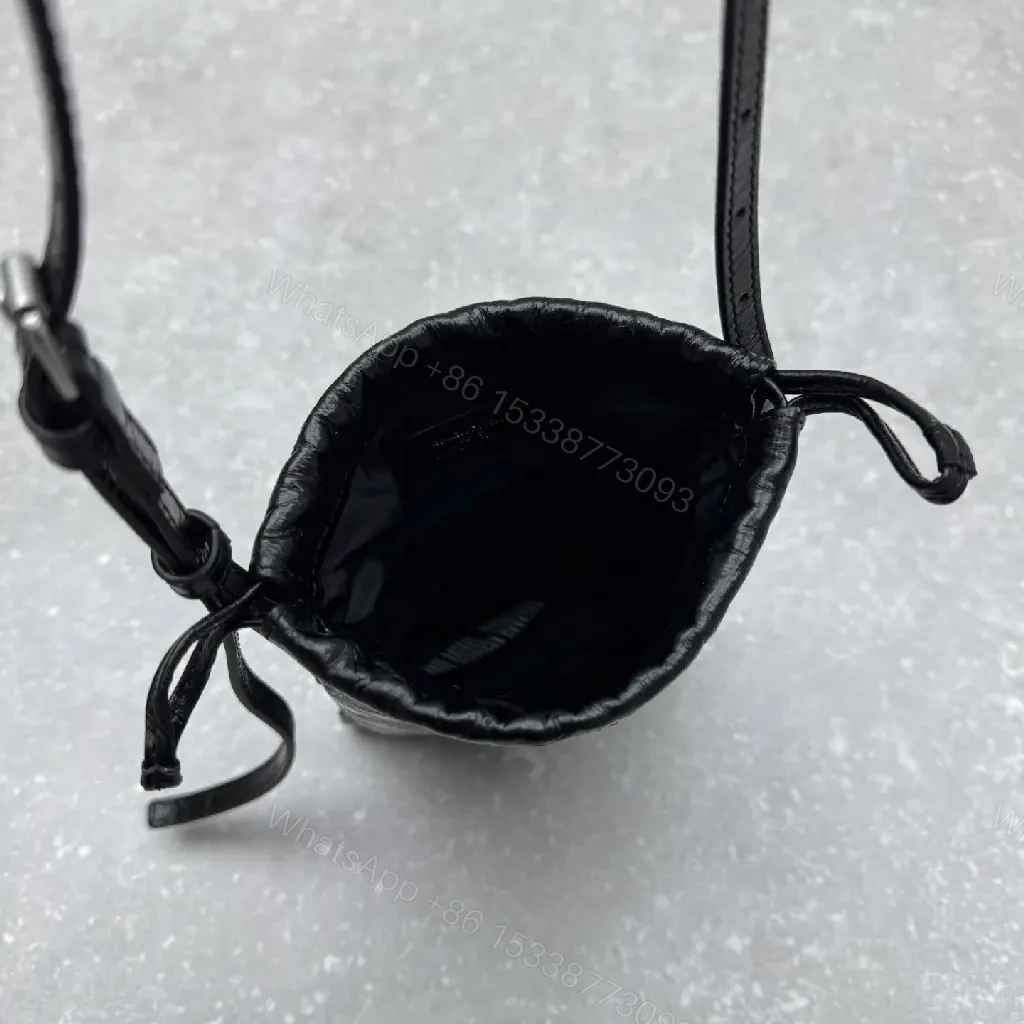 View 10 of Black Leather Drawstring Crossbody Bag - Minimalist Luxe Compact Carry