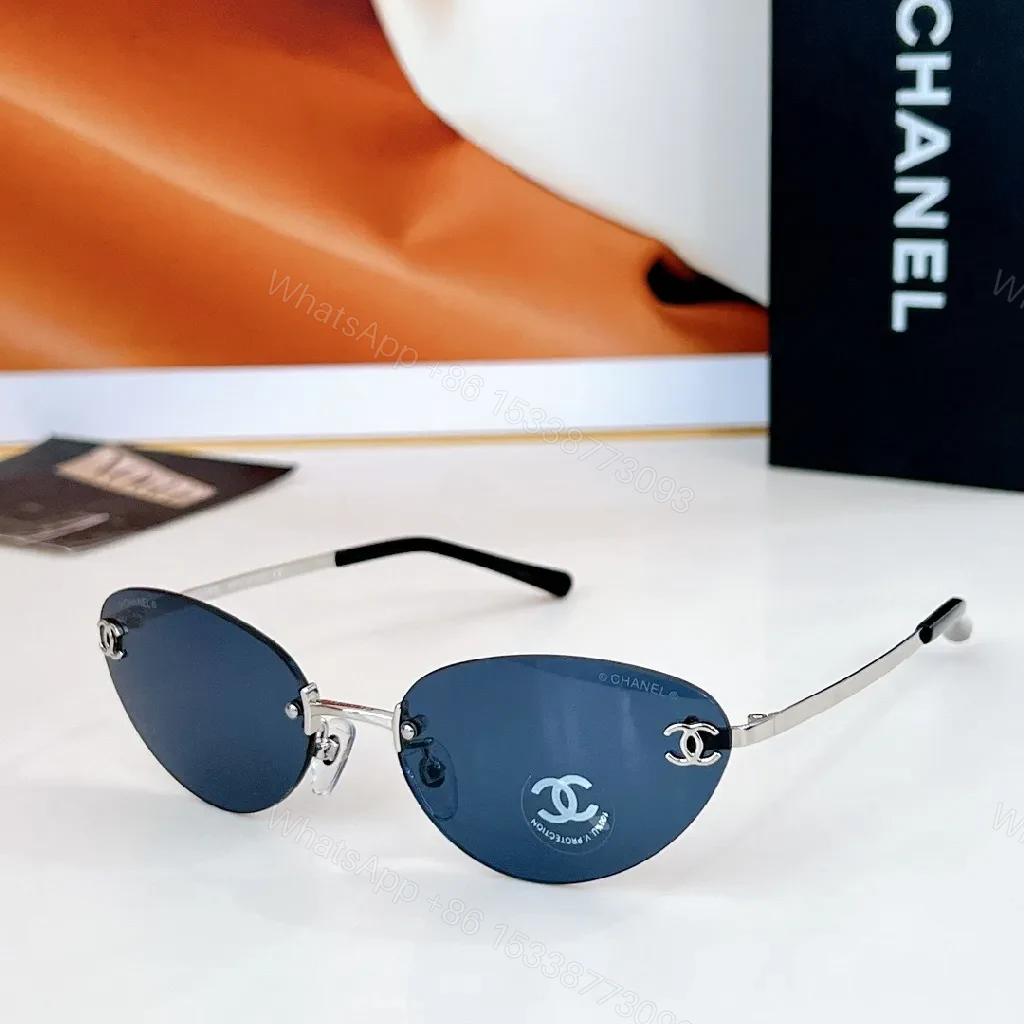 View 2 of Rimless Blue Lens Sunglasses with Gold-Tone Frames
