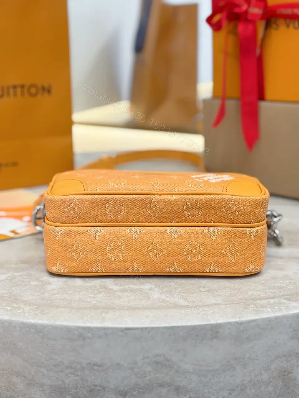View 7 of Caramel Canvas Crossbody: Textured Monogram, Compact Chic