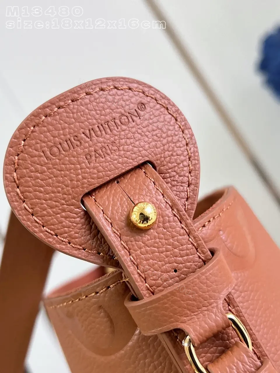 View 5 of Soft-Tone Cropped Bucket Bag with Monogram Embossing Bag