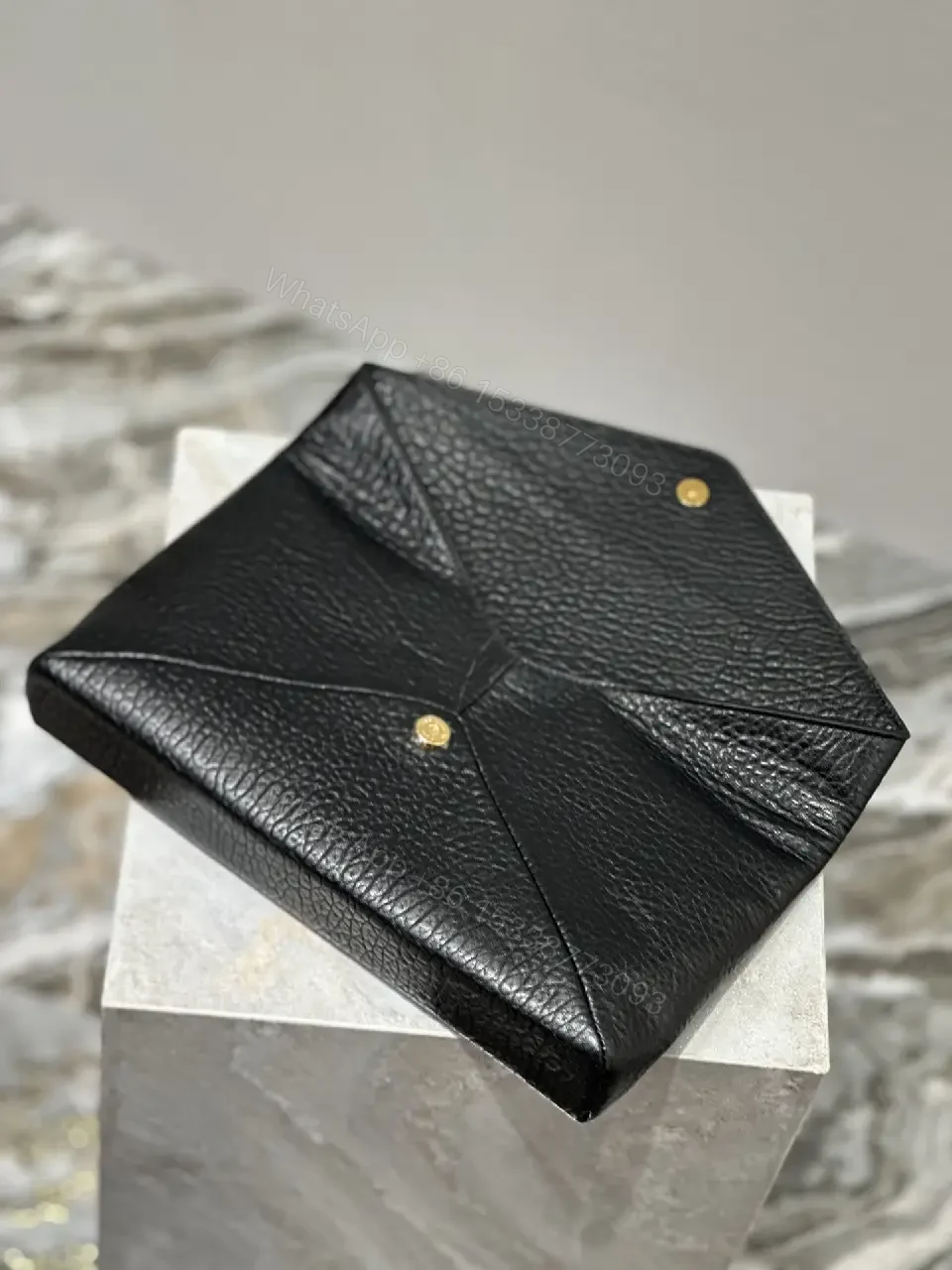View 4 of Compact Black Leather Envelope Bag with Gold Logo