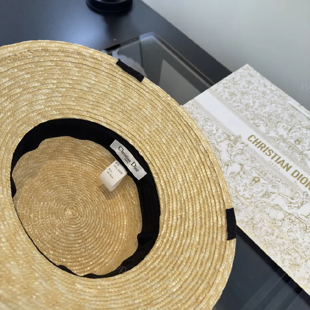 View 9 of Natural Straw Wide-Brim Hat with Black Ribbon Accent