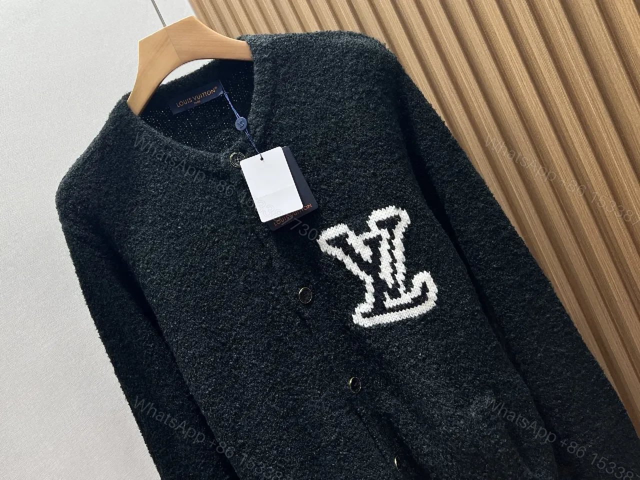 View 2 of Black Boucle Cardigan | Luxe Texture + Signature Logo + Cozy Warmth