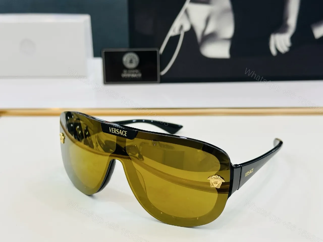 View 5 of Black Gloss Shield Sunglasses with Gold Emblems, Oversized Style