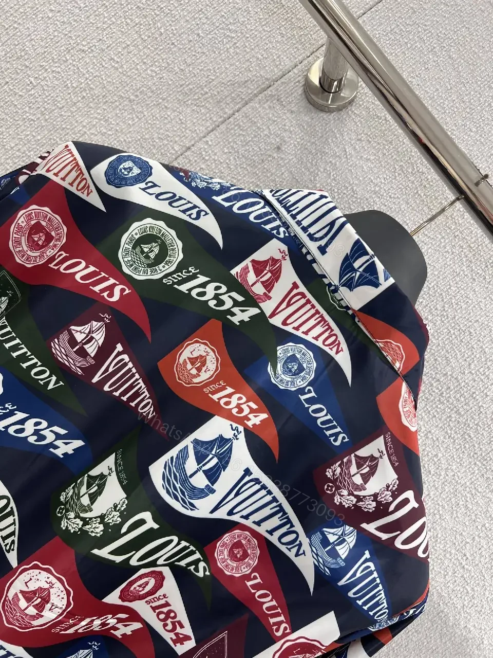 View 8 of Bold Patterned Zip Jacket: Logo Motif Luxury Streetwear