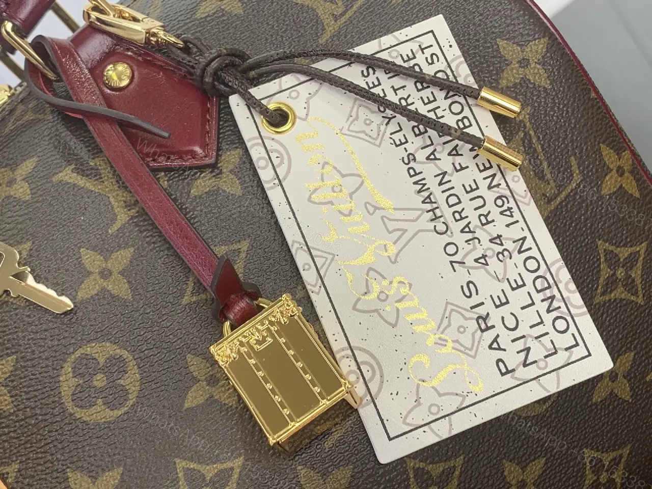 View 3 of Brown Canvas LV Monogram Travel Handbag with Burgundy Leather Trim