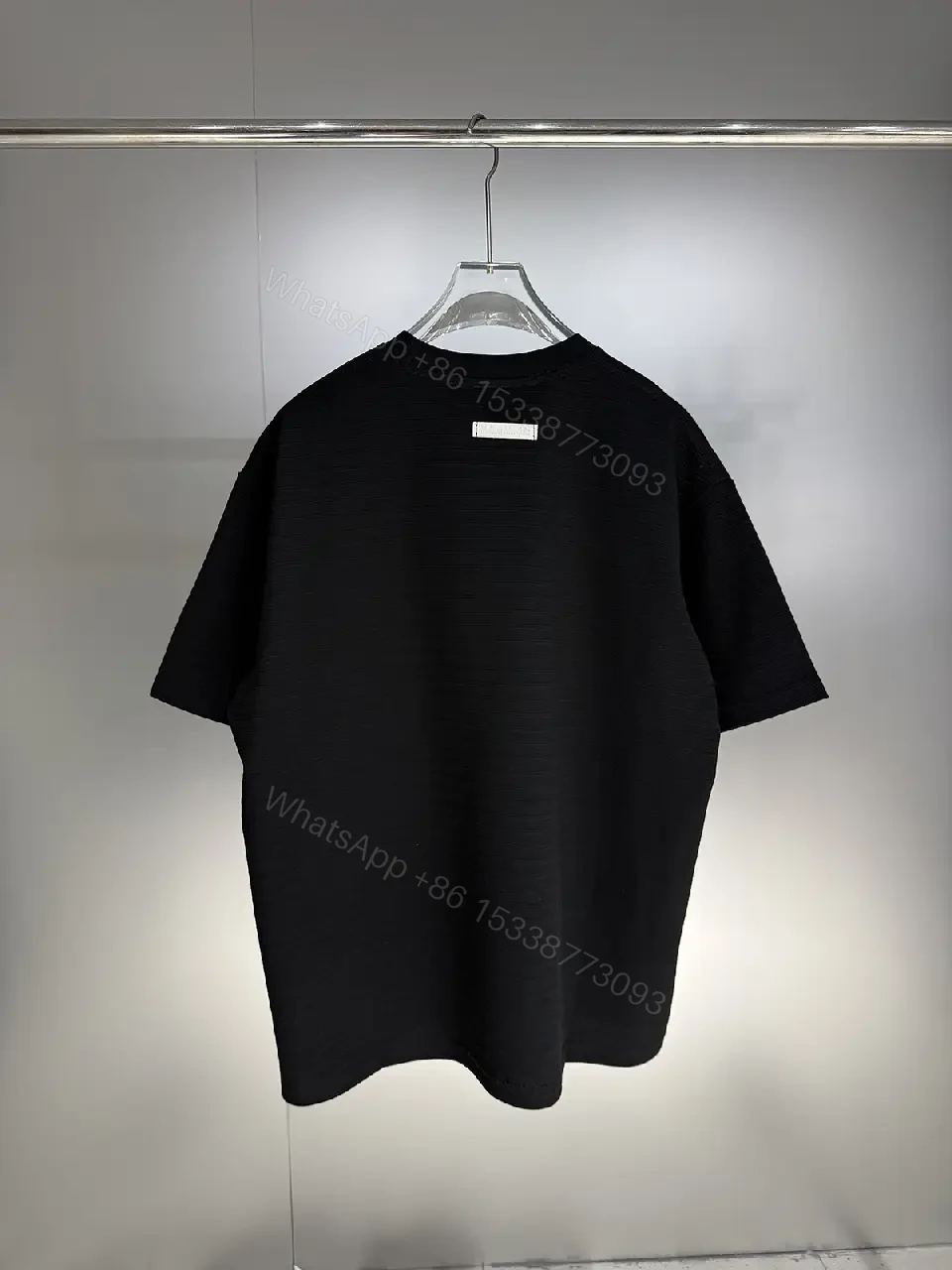 View 7 of Black Cotton Crewneck Tee + Minimalist Style + Subtle Logo + All-Day Comfort + T-Shirt