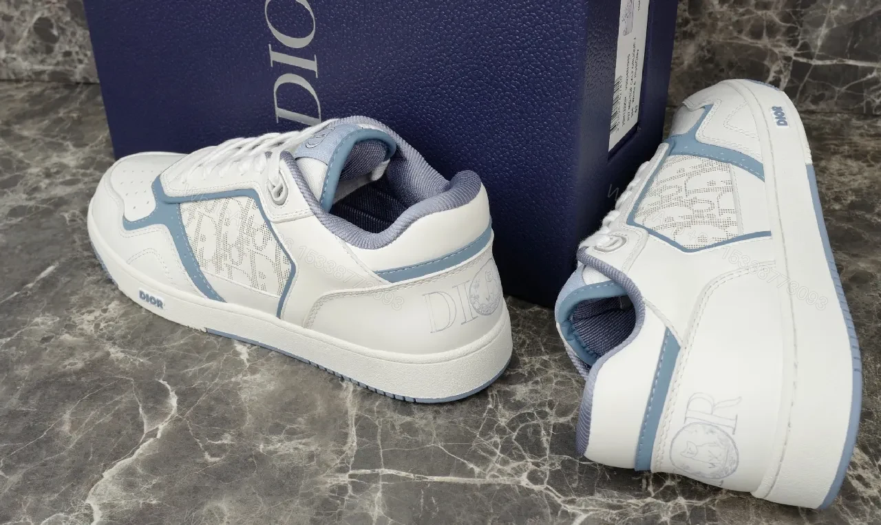 View 2 of Soft-White Leather Sneaker with Blue Accents and Signature Texture