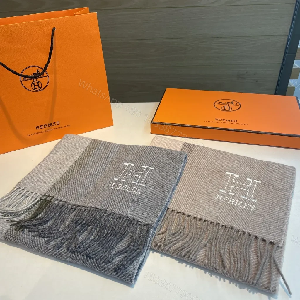 View 10 of Neutral Herringbone Knit Scarf with Subtle Emblem Detail
