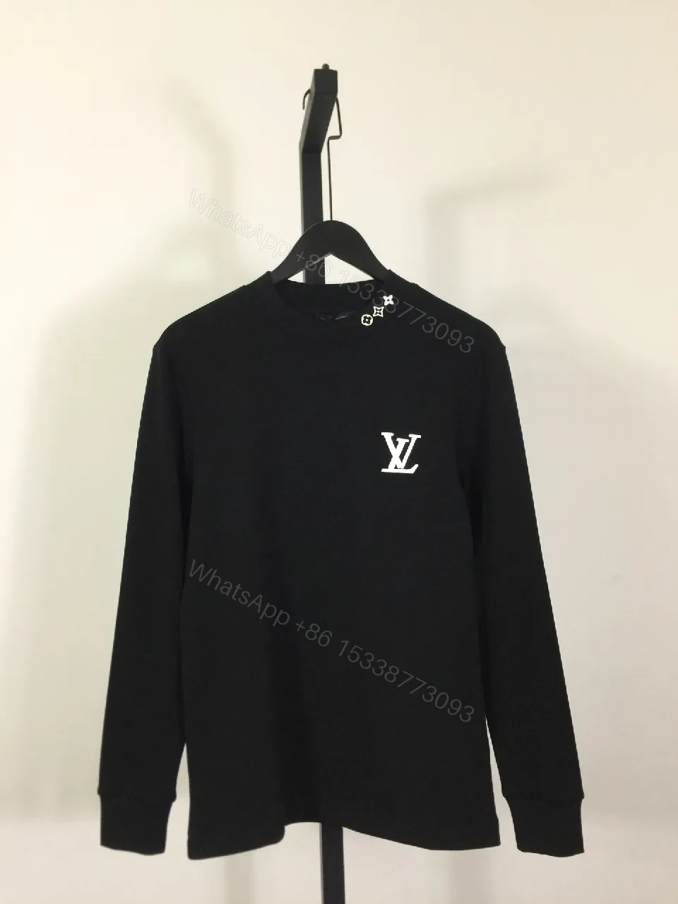 Minimalist Black Sweatshirt with Subtle Monogram Accent — view 1