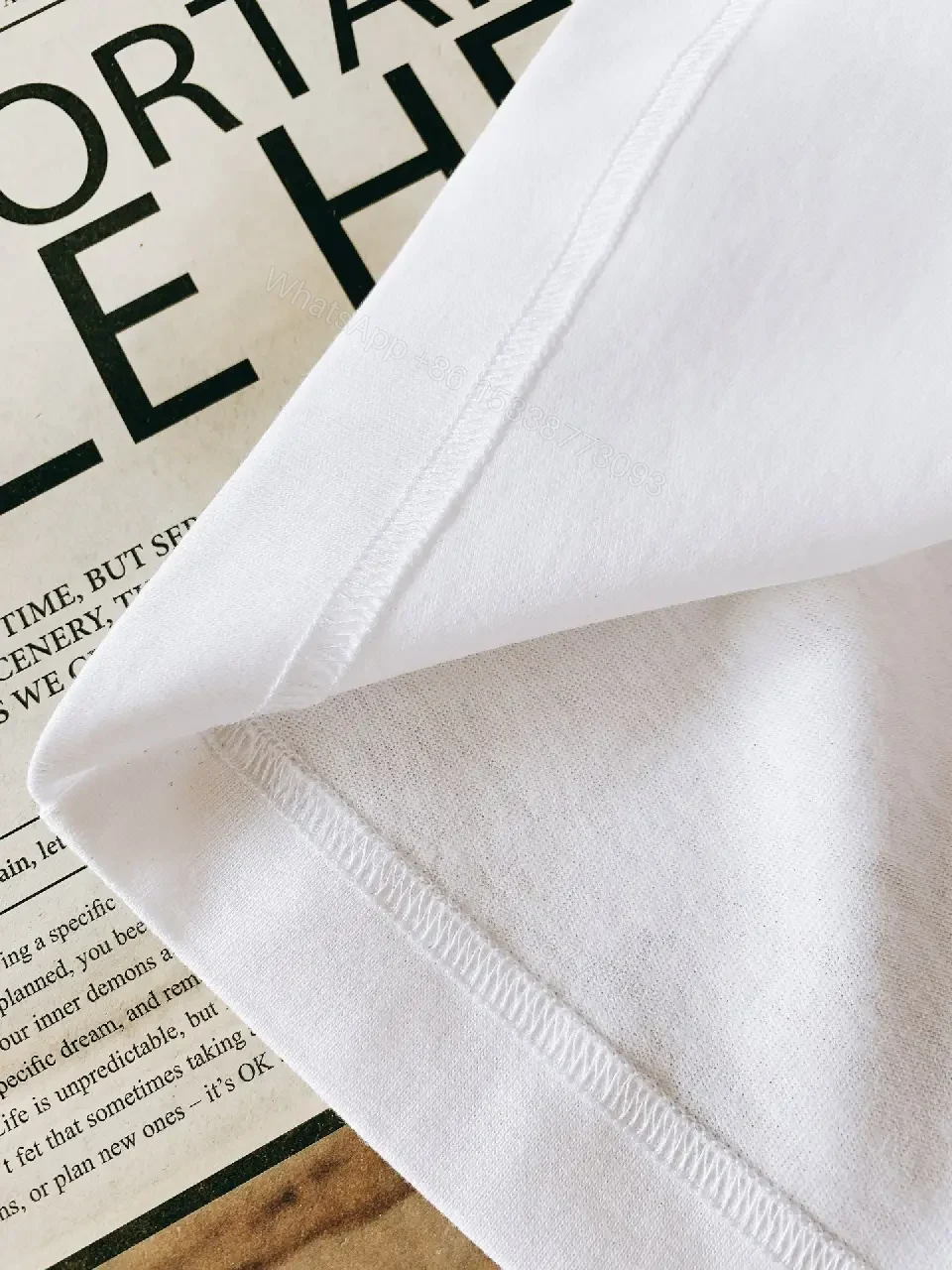 View 5 of White Cotton Crewneck Tee – Graphic Crest, Modern Luxe, Everyday Essential