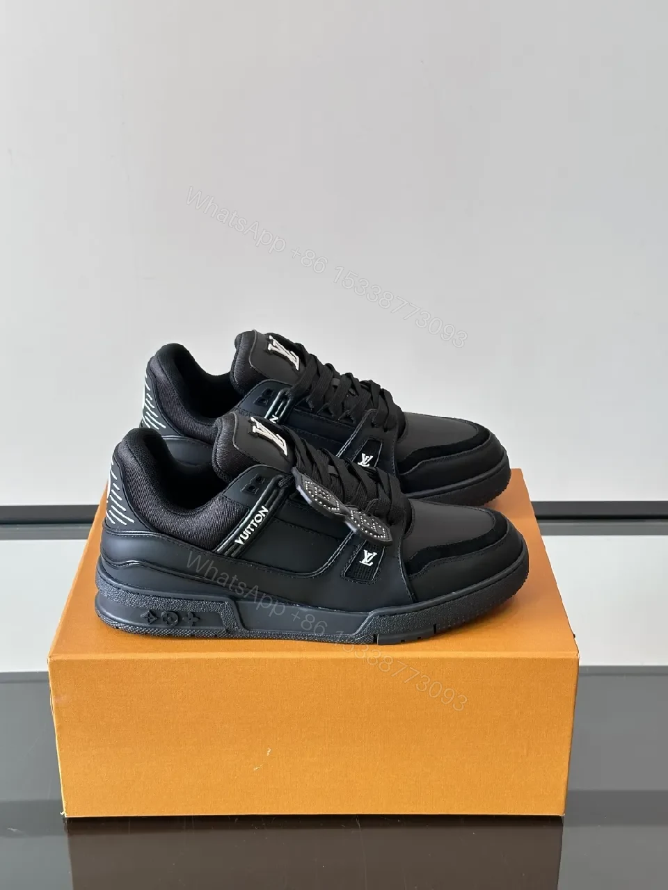 Minimalist Black Leather Sneakers: Subtle Luxe Detailing High-Top — view 1