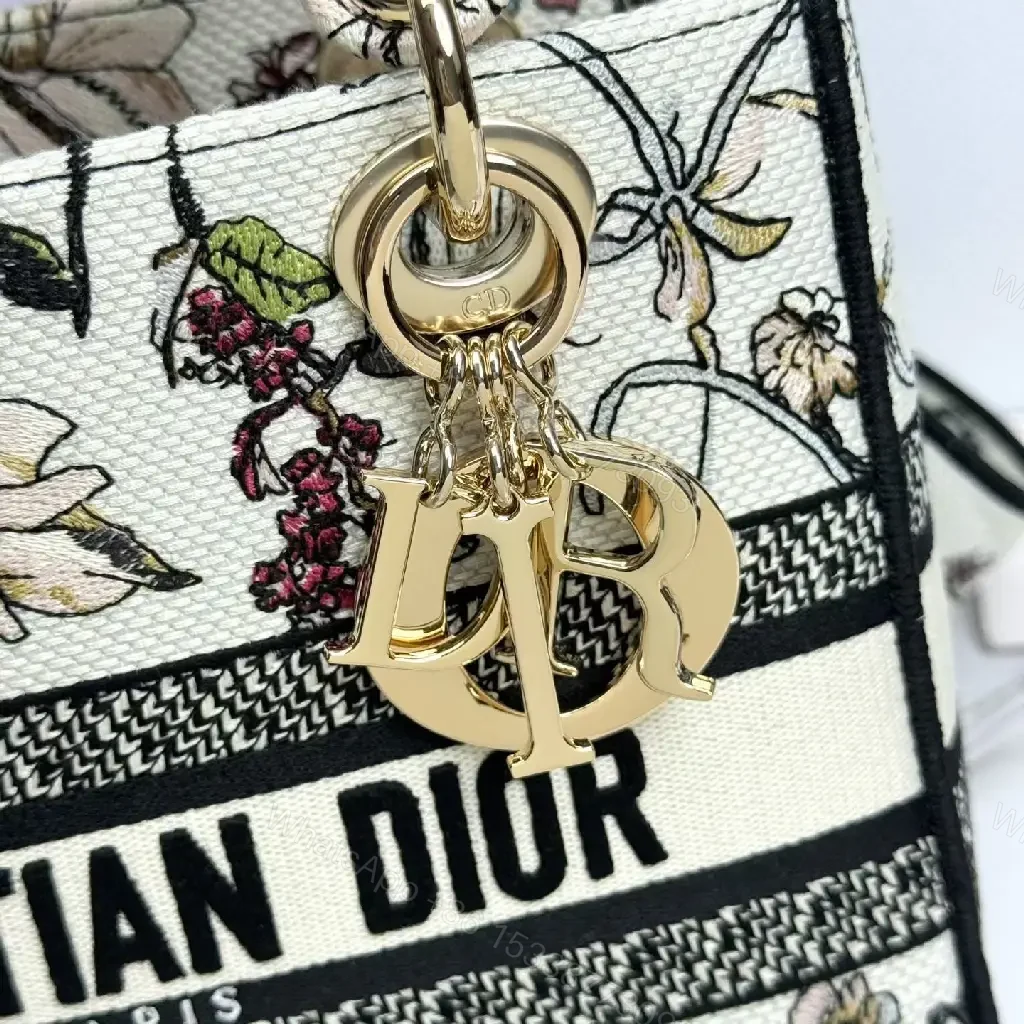 View 3 of Elegant Floral Canvas Handbag with Dior Striping