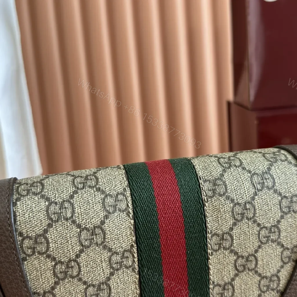 View 6 of Green Canvas Saddle Bag: Luxe Crossbody with Web Stripe and Gold Hardware