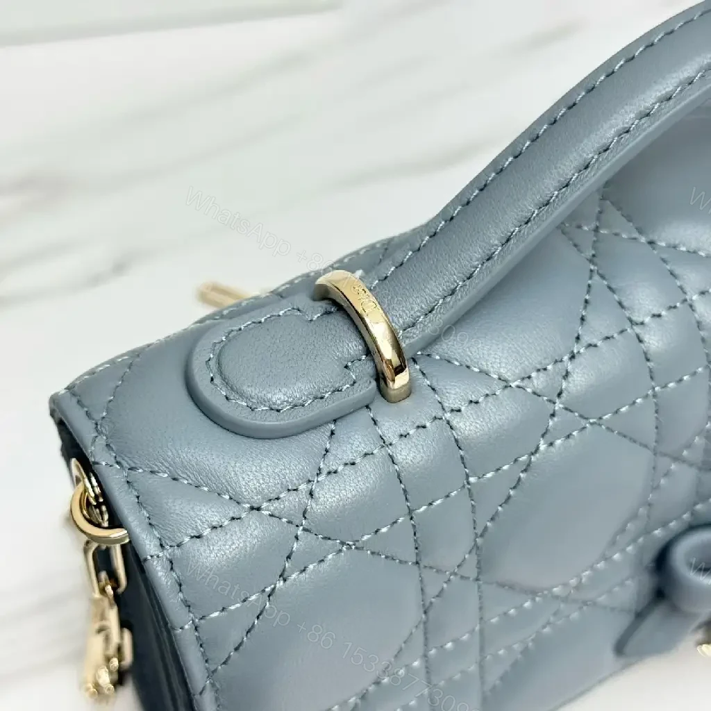 View 2 of Muted Blue-Gray Quilted Crossbody with Bow Charm, Luxe Everyday
