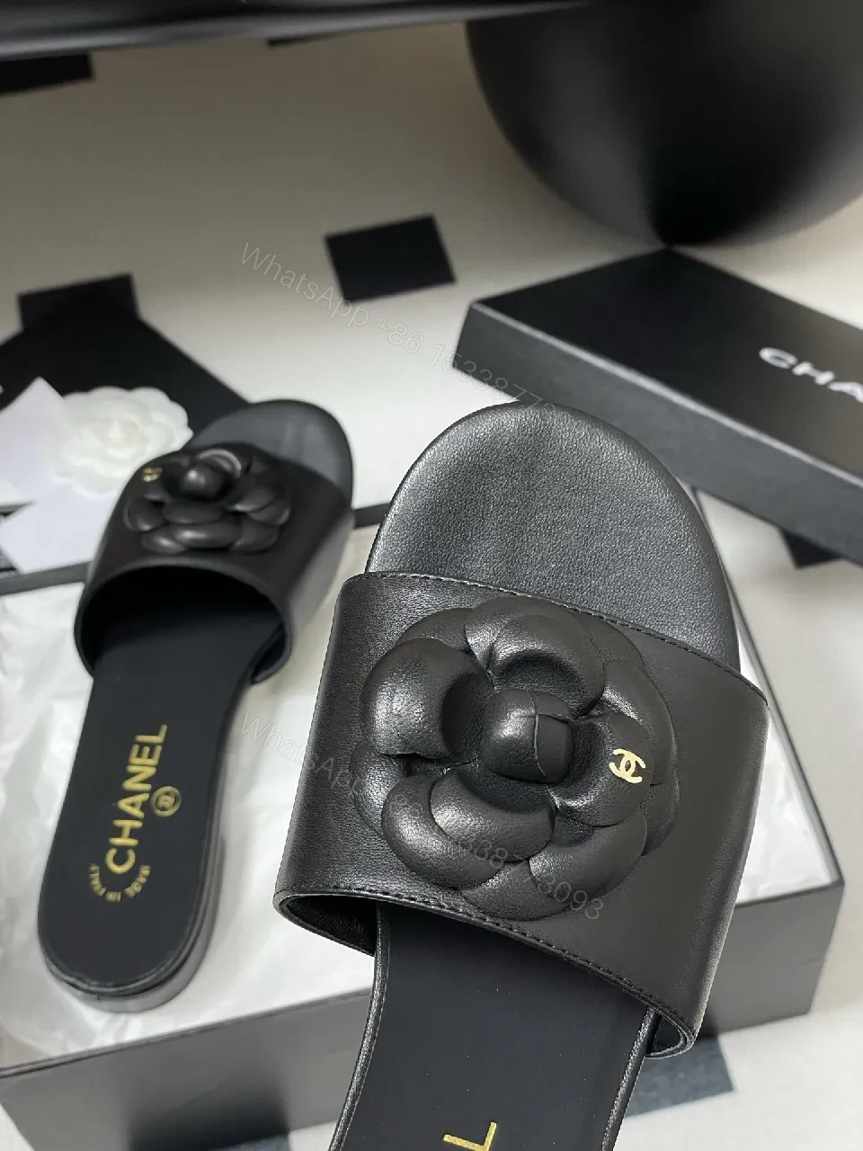 View 6 of Effortless Black Leather Slide with Camellia Detail