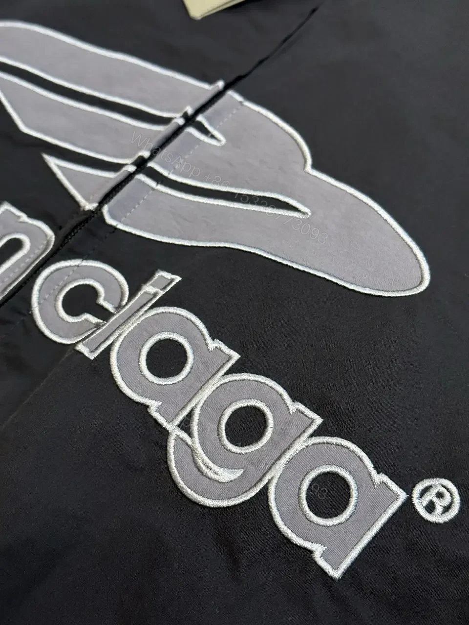 View 8 of Black Nylon Windbreaker Modern Logo-Driven Streetwear Jacket