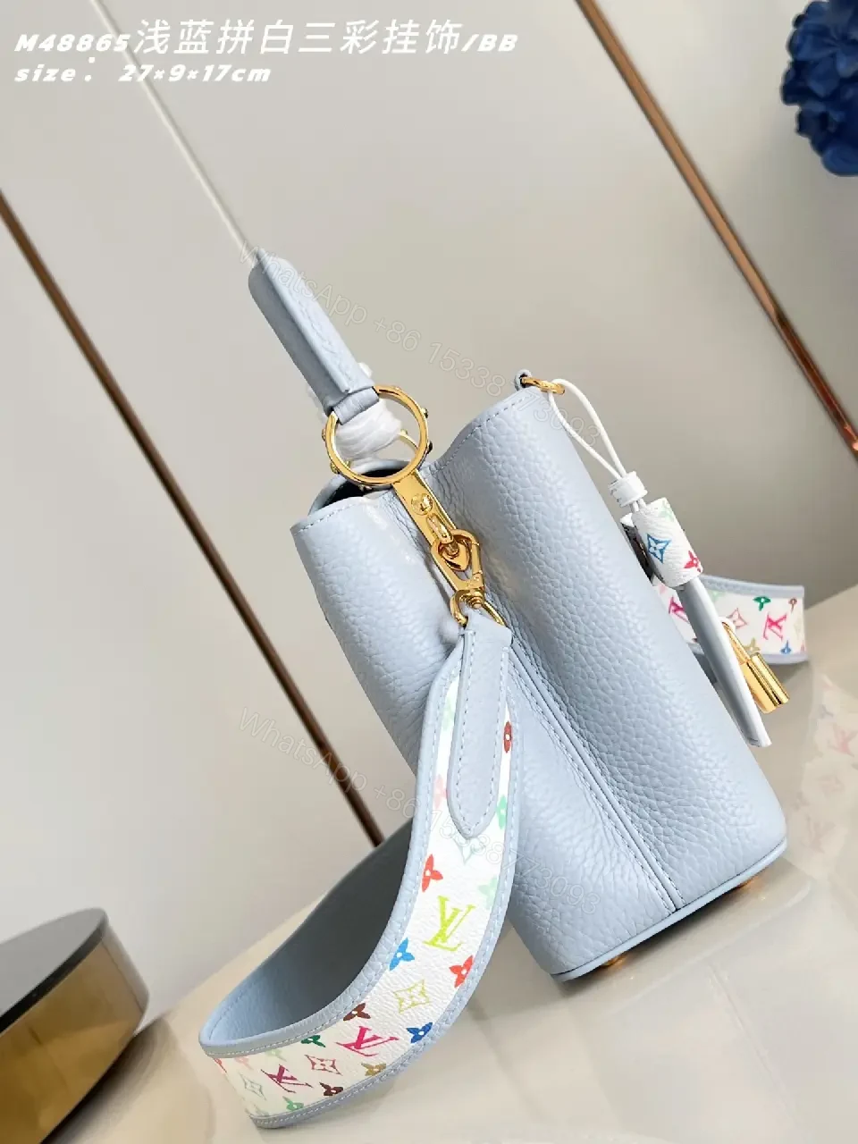 View 3 of Light Blue Leather Handbag with Gold Hardware Details