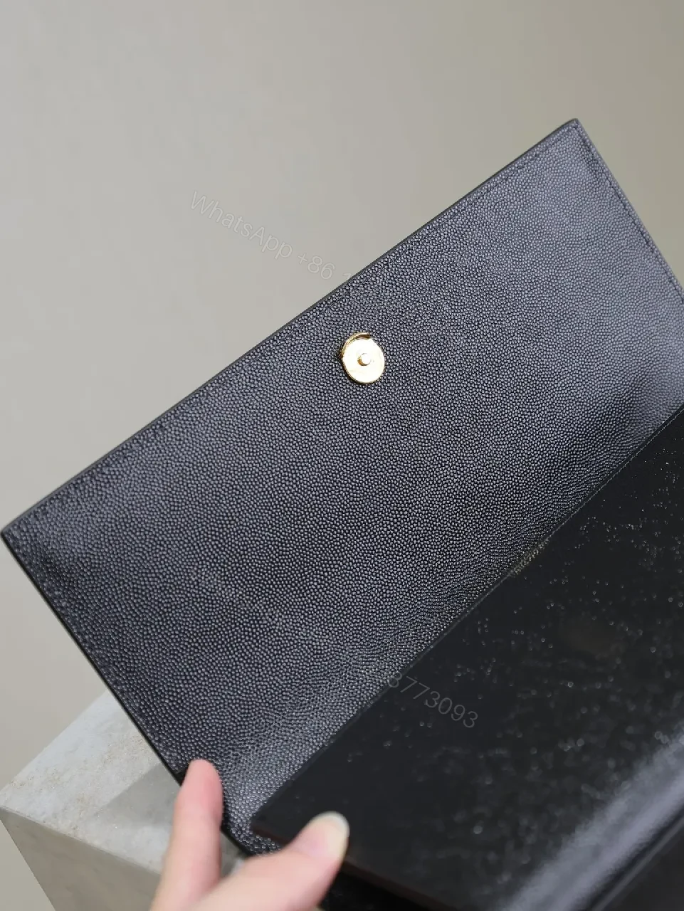 View 9 of Compact Black Calfskin Clutch with Gold-tone Hardware