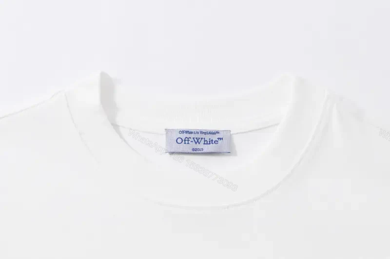 View 3 of Minimalist White Cotton Tee - Subtle Logo, Modern Luxe