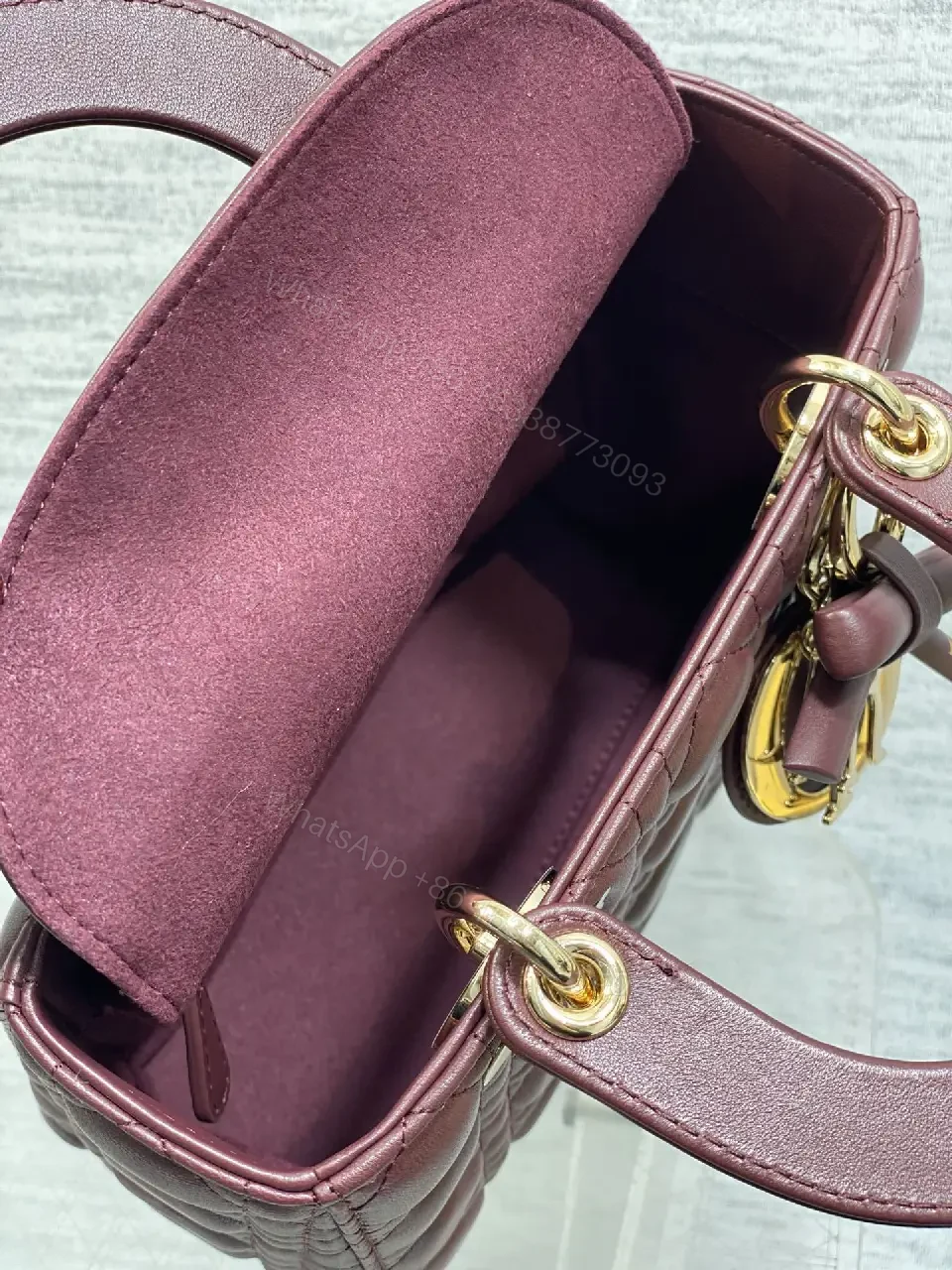 View 5 of Quilted Burgundy Handbag with Top Handles, Structured Charm
