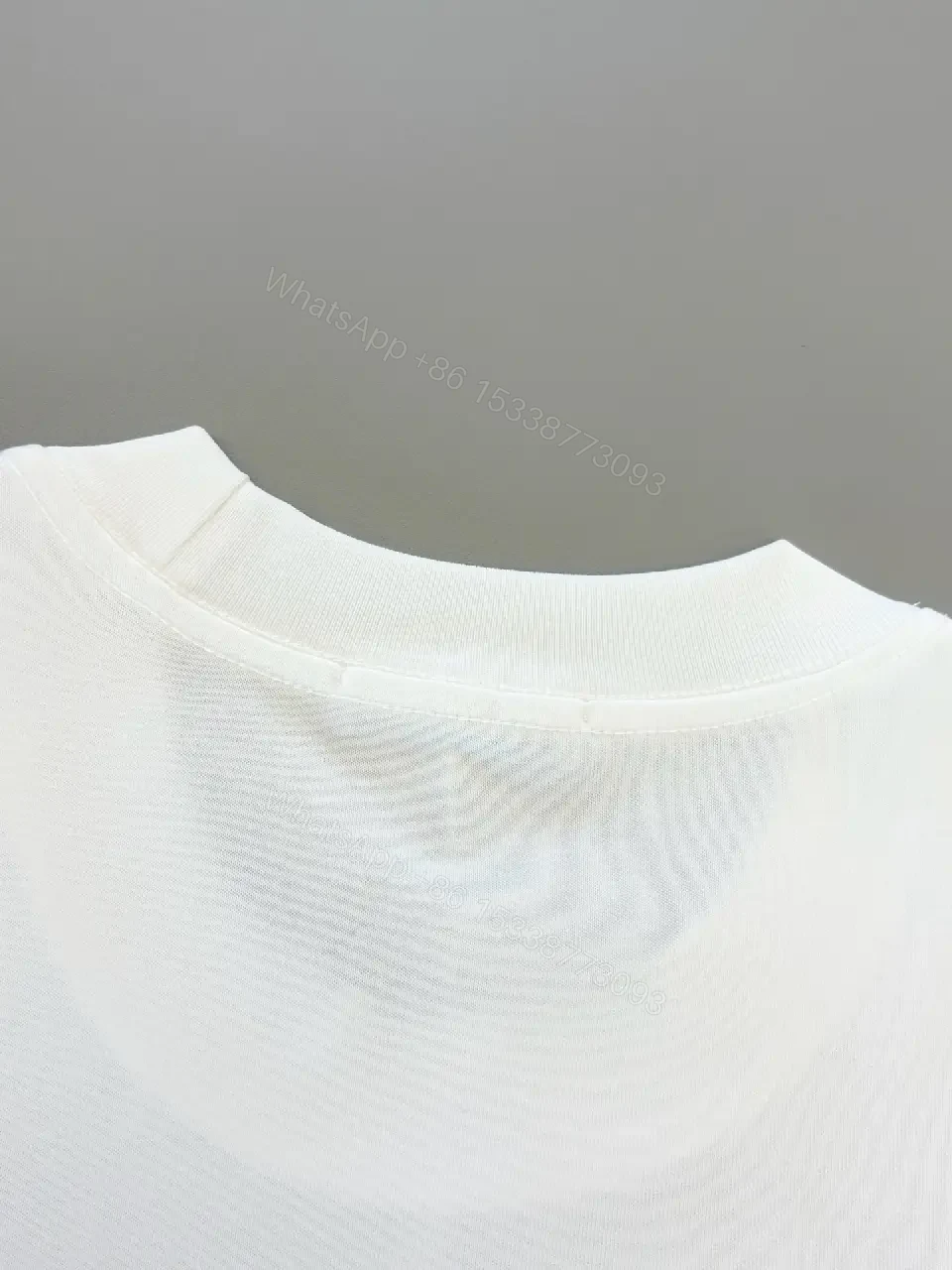 View 6 of Minimal White Tee with Bold Logo Luxury Graphic Tee