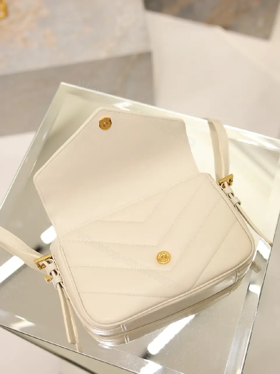View 8 of Off-White Cream Leather Mini Crossbody Bag with Chevron Front Feature