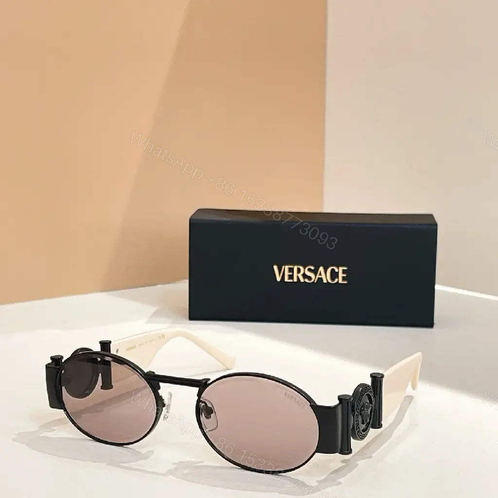 View 6 of Amber-Tinted Round Sunglasses: Gold-Accent, Sculpted Hardware, UV400 Shield