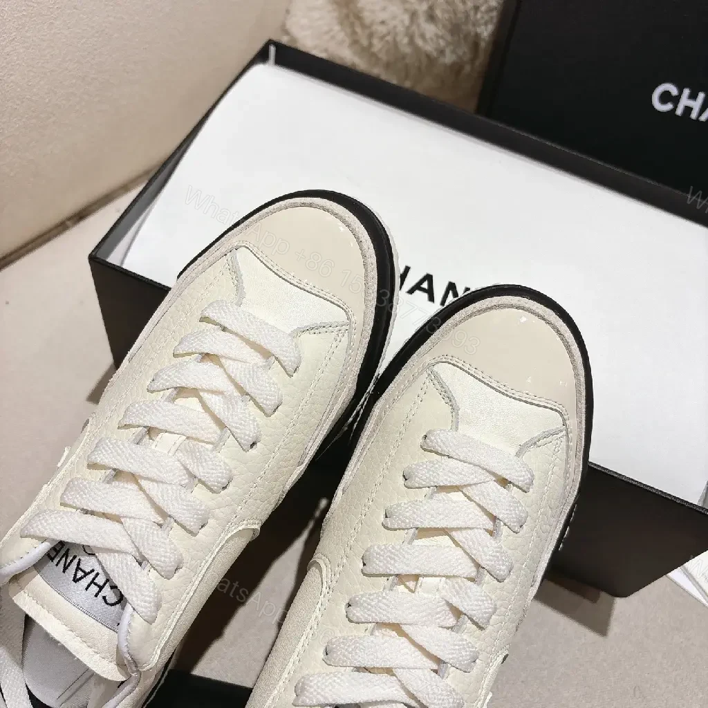 View 3 of Cream Leather-Texture Sneaker with Signature Emblem, Modern Couture Style