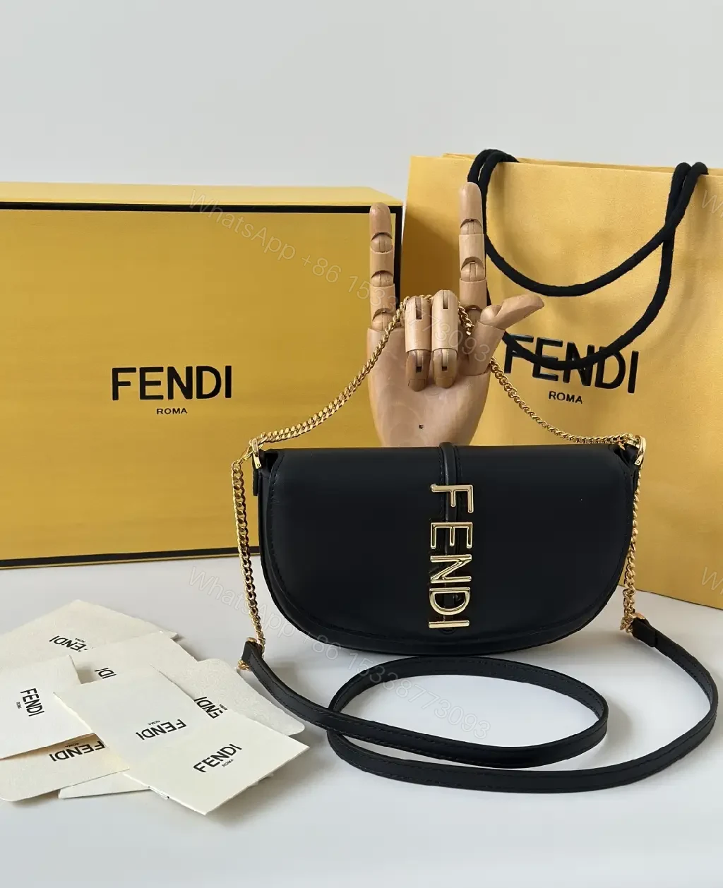 View 9 of Chic Black Leather Shoulder Bag with Gold Hardware, Compact Luxury