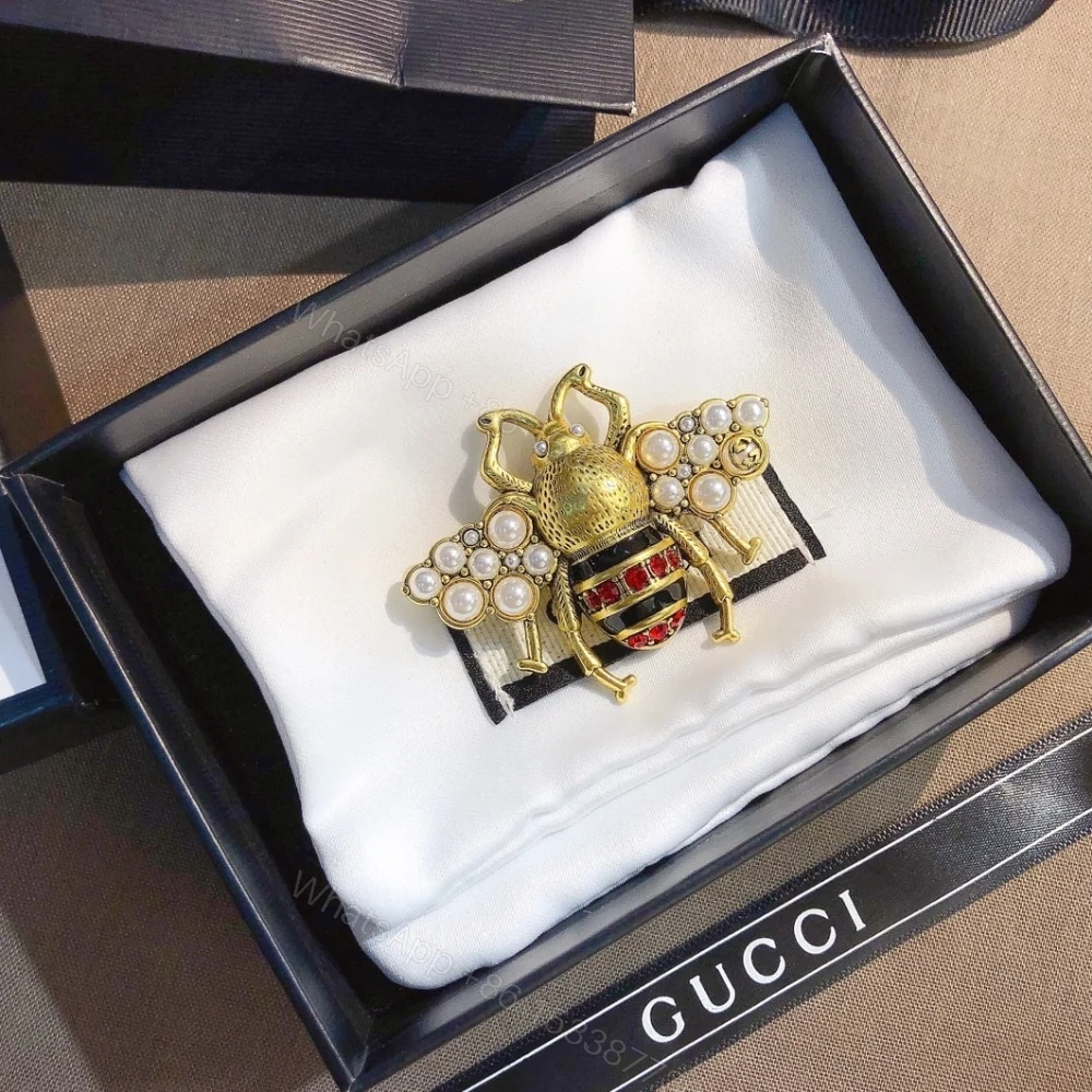 View 2 of Gucci GG Black And Red Bee Brooch Gold With Pearl