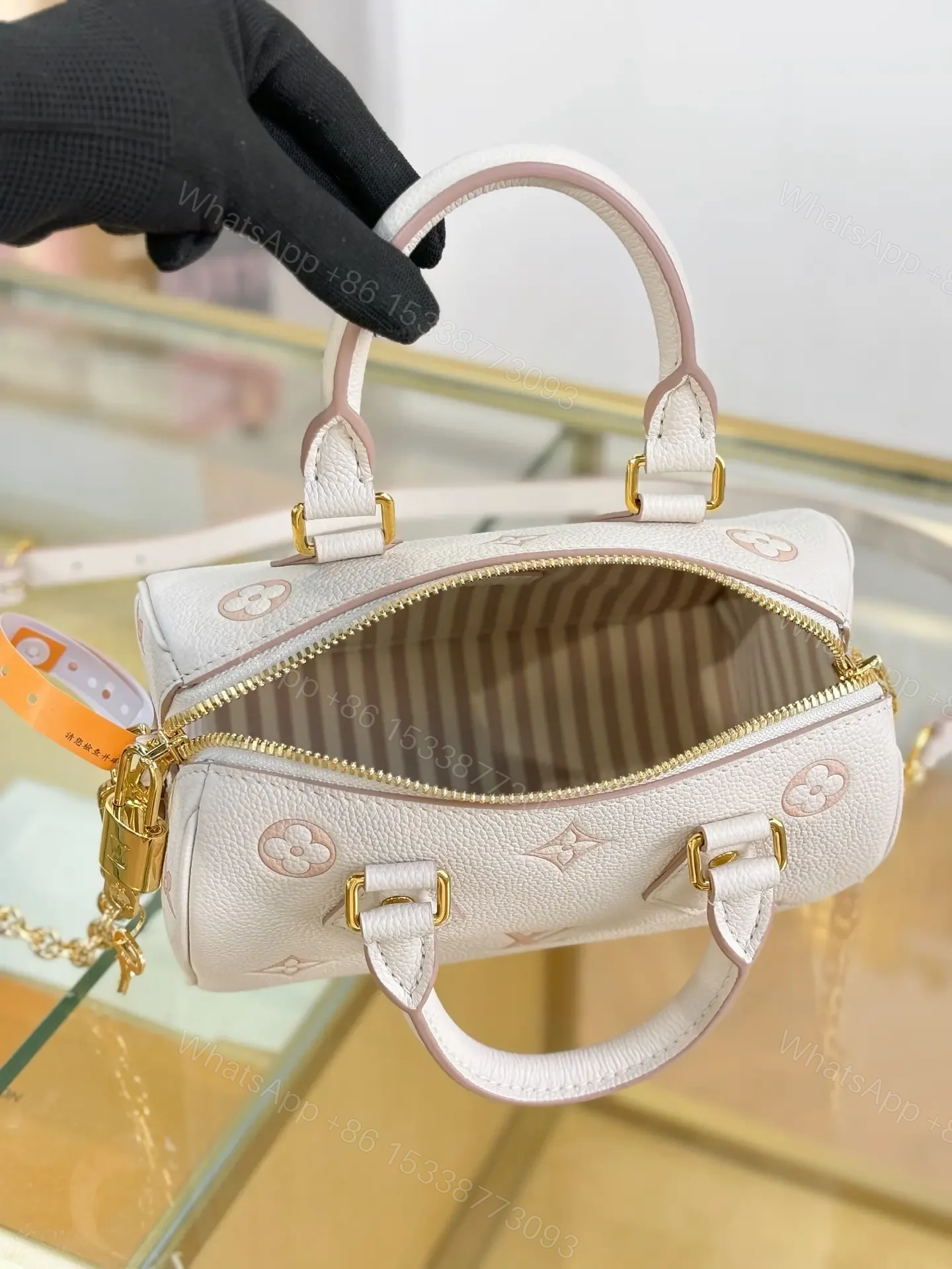 View 4 of Louis Vuitton Monogram Empreinte Bicolor Speedy Bandoulière 20