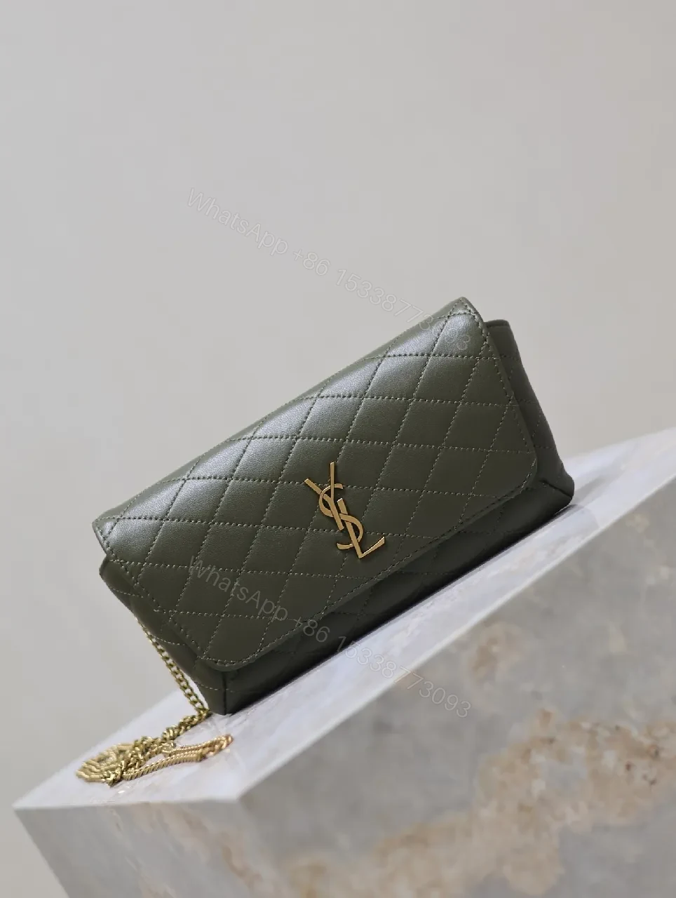 View 3 of Soft-Quilted Leather Clutch with Gold Emblem, Evening Style, Compact Luxury